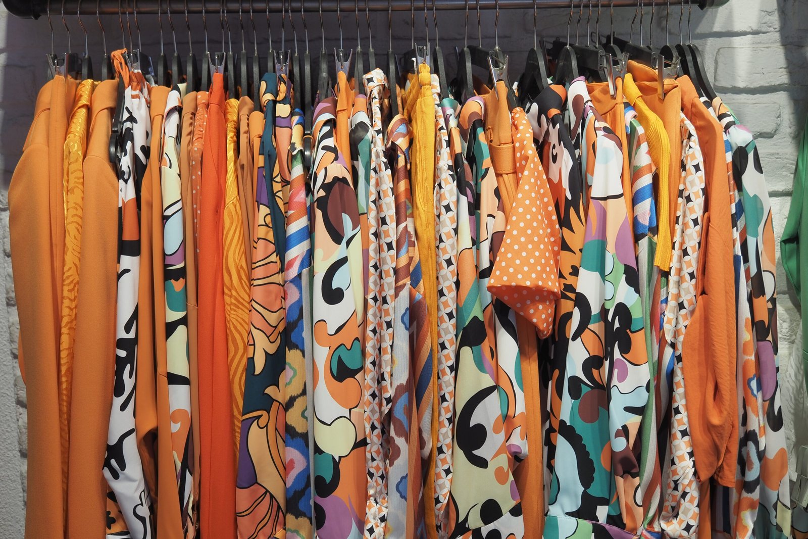 close up of many women cloths display for sale .